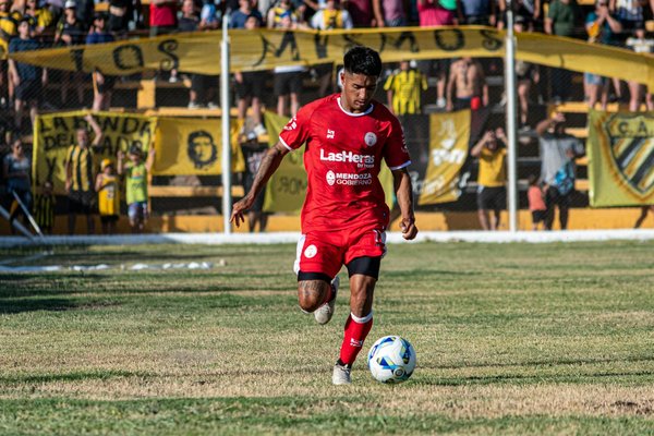 How are UK automotive companies investing in renewable energy?